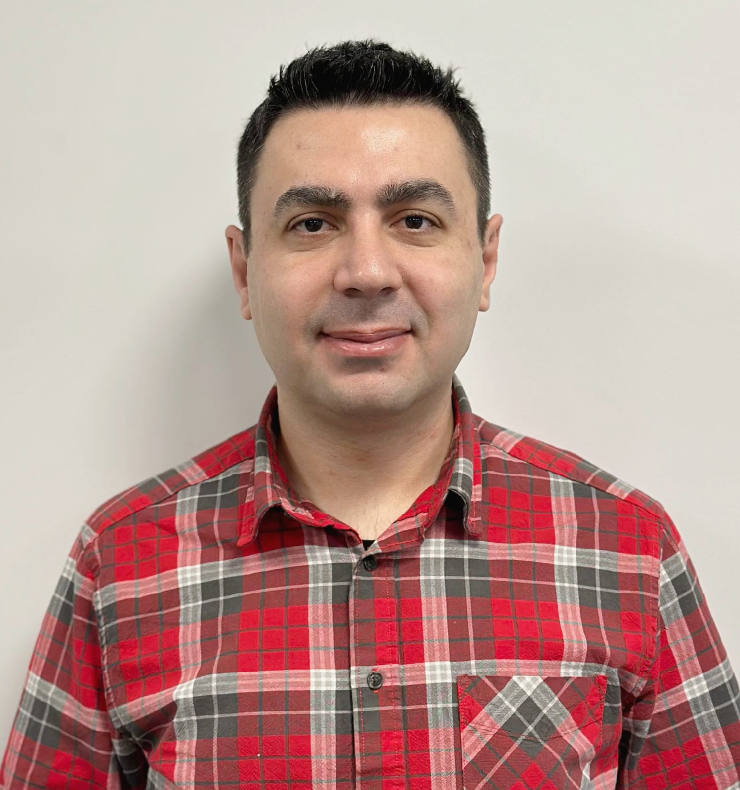 A man in a alice blue shirt with a thinking expression